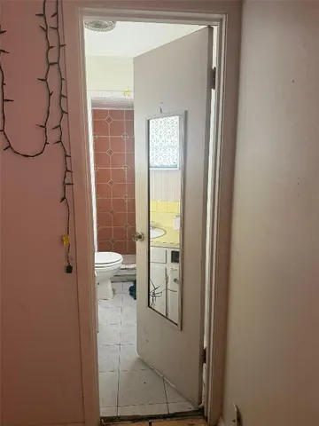 a bathroom with a glass door shower