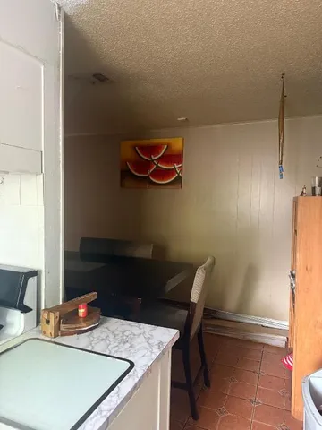 a room with a table and chairs