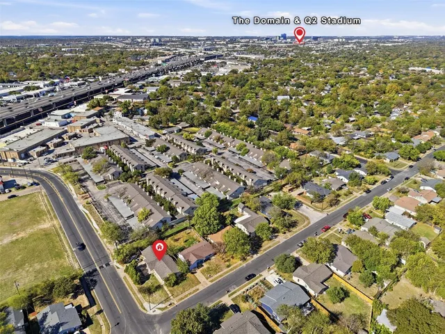 an aerial view of residential houses with outdoor space