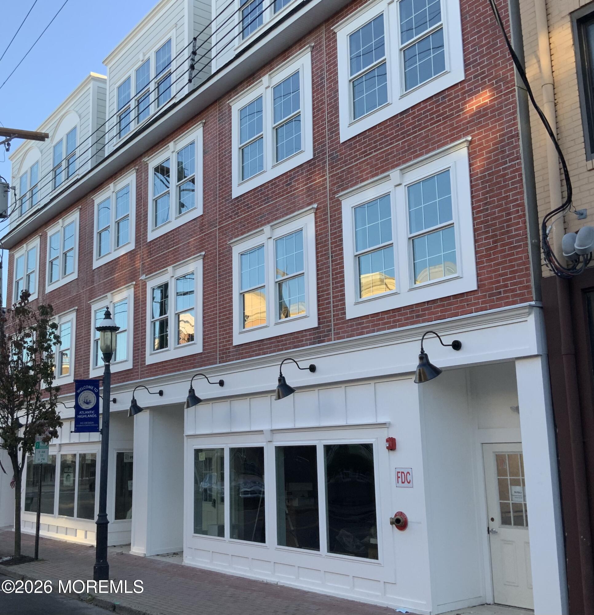 48 First Avenue, Unit 302 Atlantic Highlands, NJ 07716 - Photo 1 of 9 a building with a window and balcony