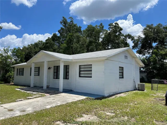 a backyard of a house with lots of green space