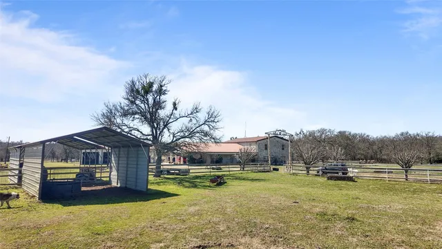 a view of swimming pool and trees in the background
