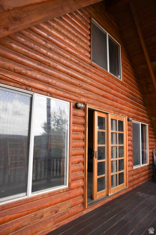 15253 Mill Road, Unit 62 Huntsville, UT 84317 - Photo 38 of 48 Exterior log siding with multiple windows and a wood-finish deck