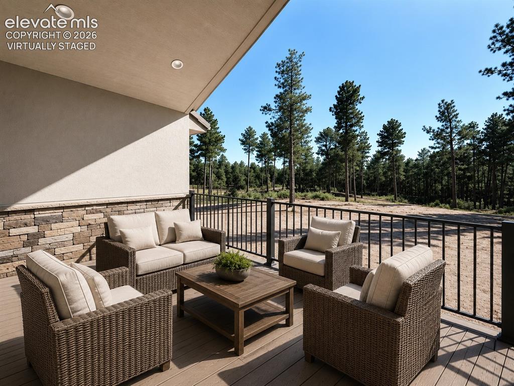 3145 Promise Point Colorado Springs, CO 80921 - Photo 7 of 28 Covered Composite Deck. Virtually Staged.