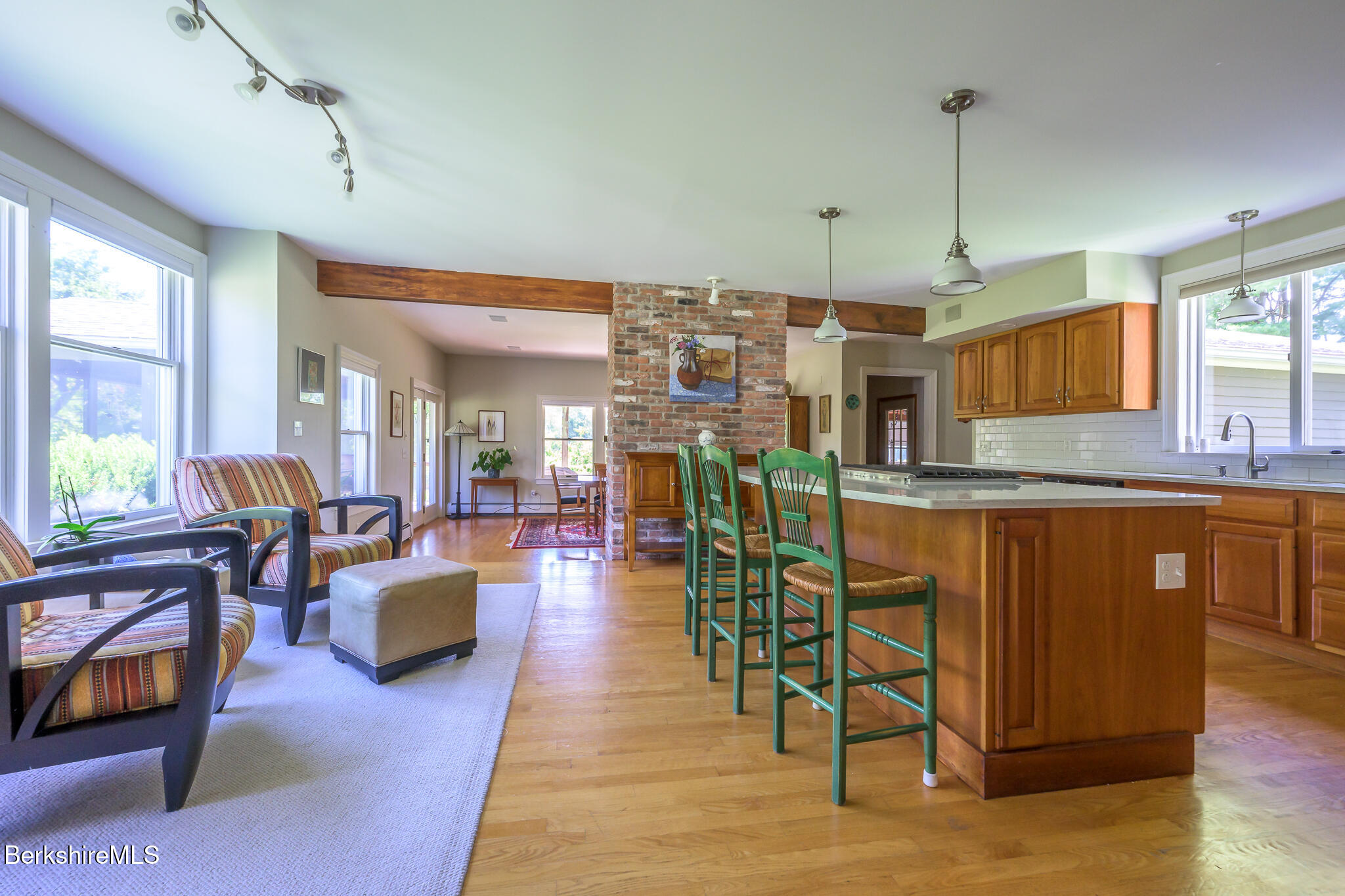 51 Albany Road West Stockbridge, MA 01266 - Photo 15 of 58 a living room with stainless steel appliances granite countertop a refrigerator a sink dishwasher a dining table and chairs with wooden floor