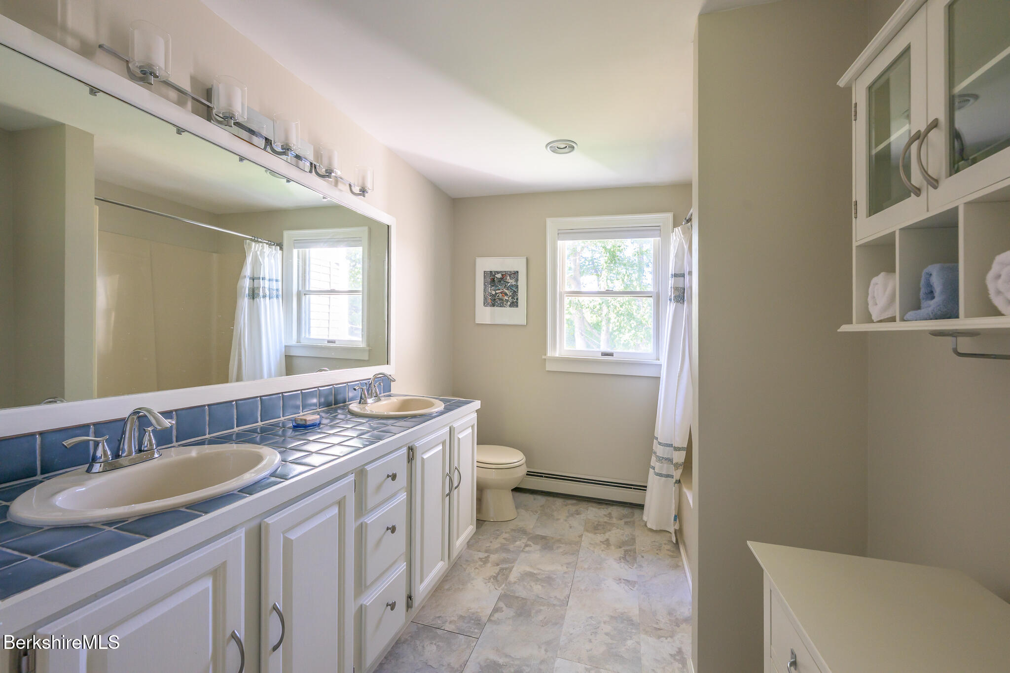 51 Albany Road West Stockbridge, MA 01266 - Photo 35 of 58 a spacious bathroom with a double vanity sink a mirror and a toilet