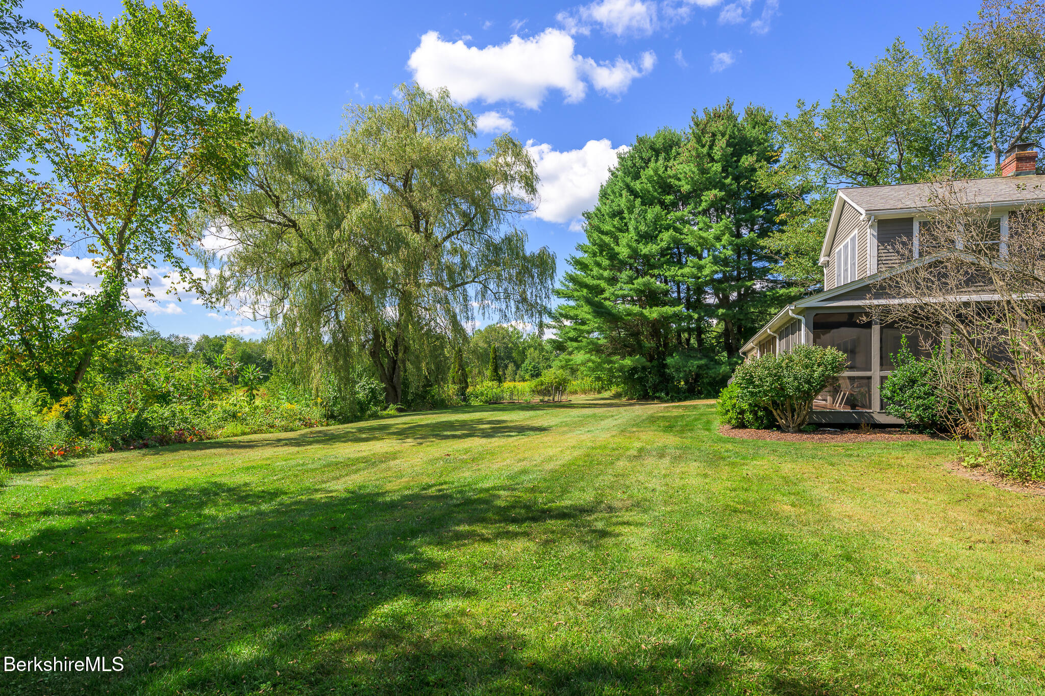 51 Albany Road West Stockbridge, MA 01266 - Photo 45 of 58 a view of a house with a big yard and palm trees