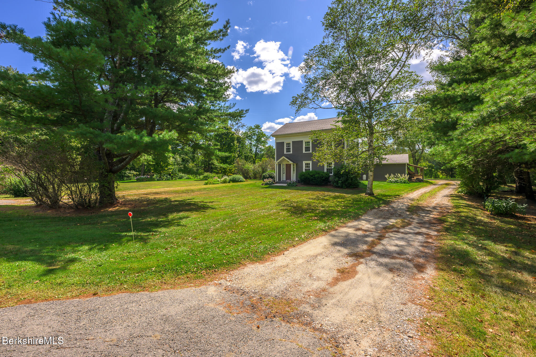 51 Albany Road West Stockbridge, MA 01266 - Photo 7 of 58 a garden with trees in front of it