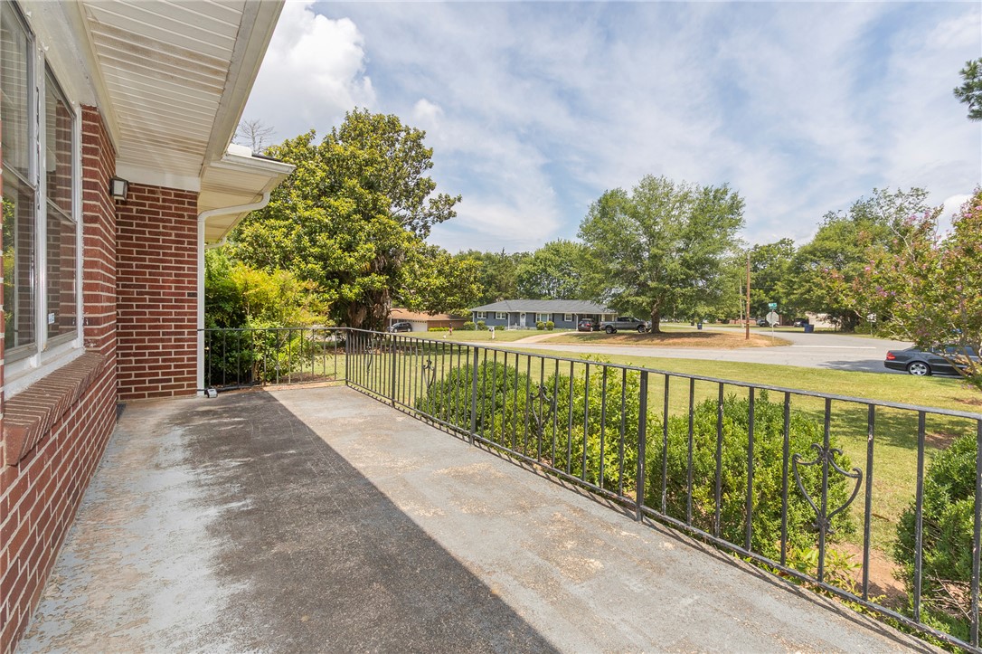 1218 Bolt Drive Anderson, SC 29621 - Photo 5 of 46 A classic brick exterior extends to a charming porch with wrought iron railings.