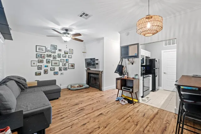 a view of a livingroom with furniture and a window