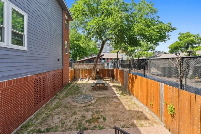 a view of a balcony with wooden floor