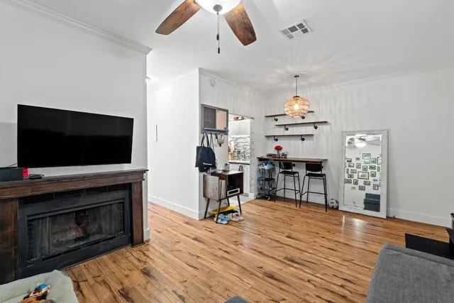 a living room with furniture fireplace and flat screen tv