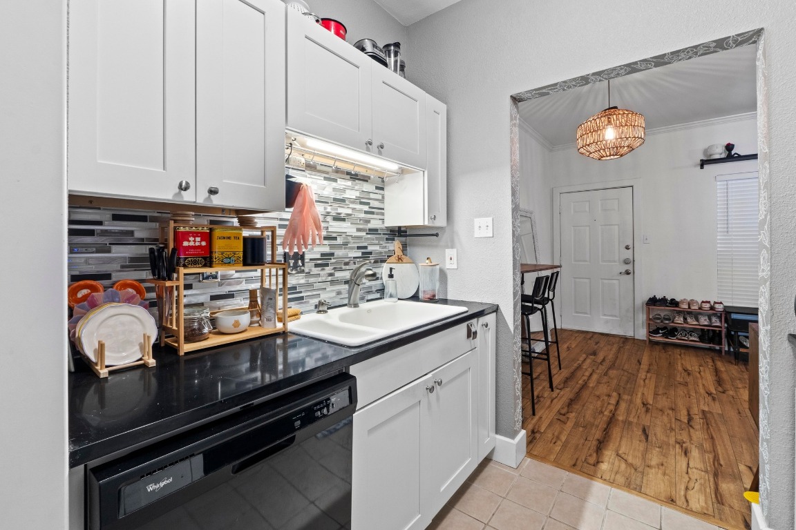 2804 Rio Grande Street, Unit 206 Austin, TX 78705 - Photo 6 of 21 a kitchen that has a sink and cabinets