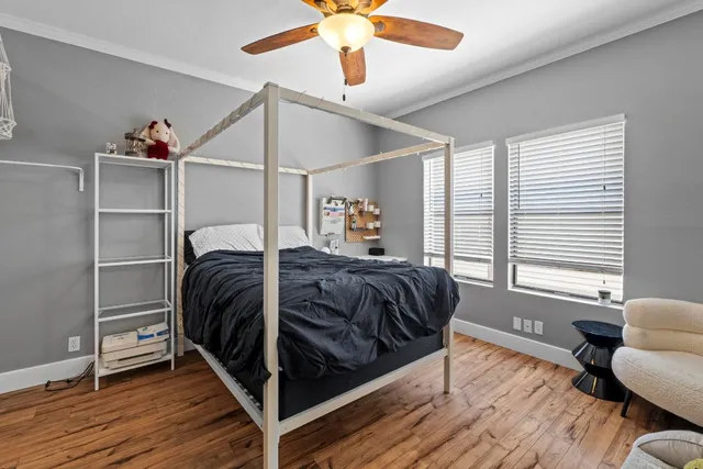 a bedroom with a bed and window