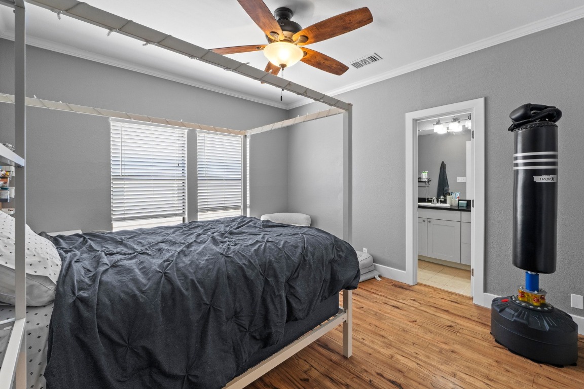 2804 Rio Grande Street, Unit 206 Austin, TX 78705 - Photo 8 of 21 a bedroom with a bed and a flat screen tv