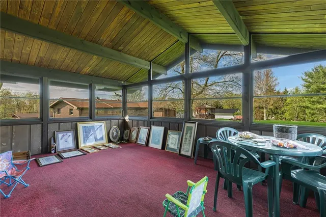 a view of a patio with a table and chairs
