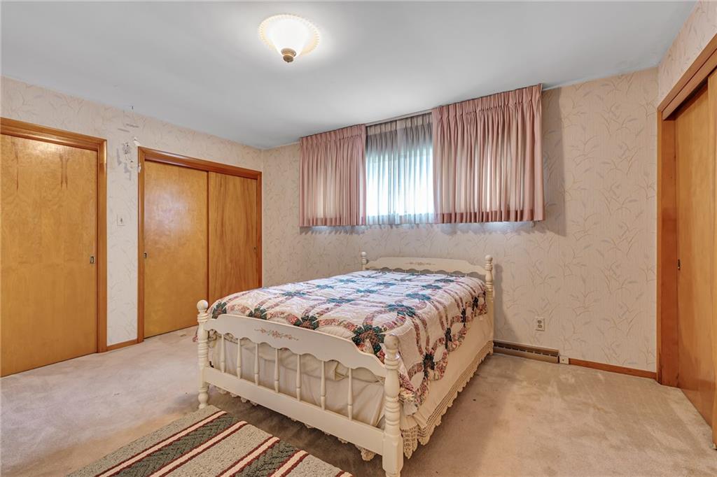 145 Oakhill Road Aliquippa, PA 15001 - Photo 15 of 23 a bedroom with a bed and a window