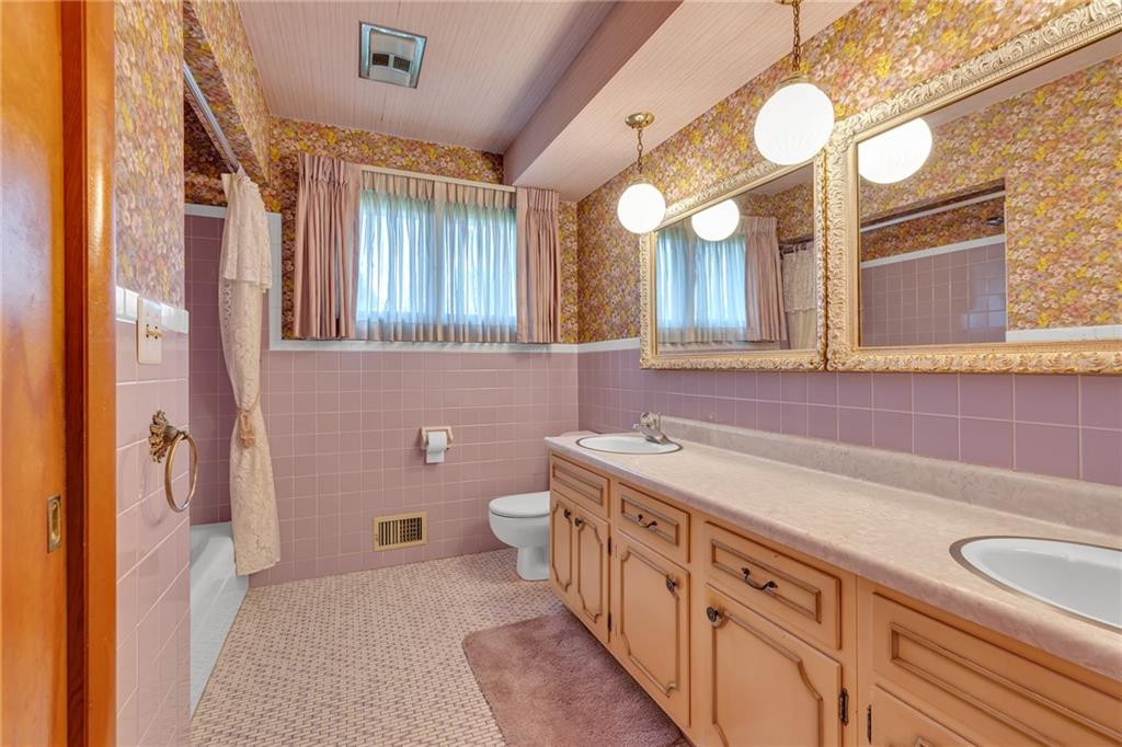 145 Oakhill Road Aliquippa, PA 15001 - Photo 17 of 23 a bathroom with a sink and a mirror