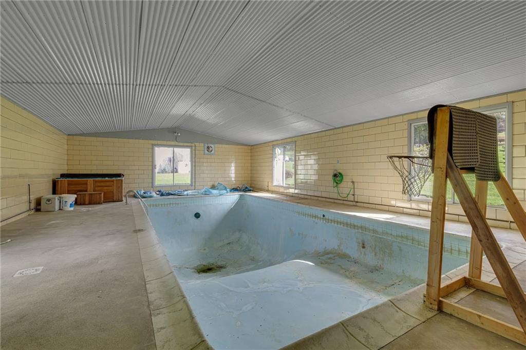 145 Oakhill Road Aliquippa, PA 15001 - Photo 21 of 23 a bathroom with a tub sink and mirror