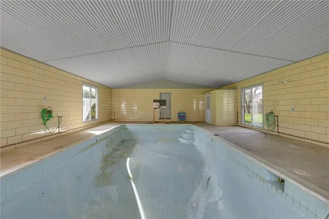 a view of a livingroom with wooden floor and a window