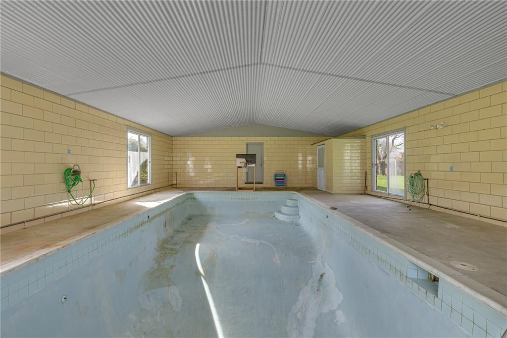 145 Oakhill Road Aliquippa, PA 15001 - Photo 22 of 23 a view of a livingroom with wooden floor and a window