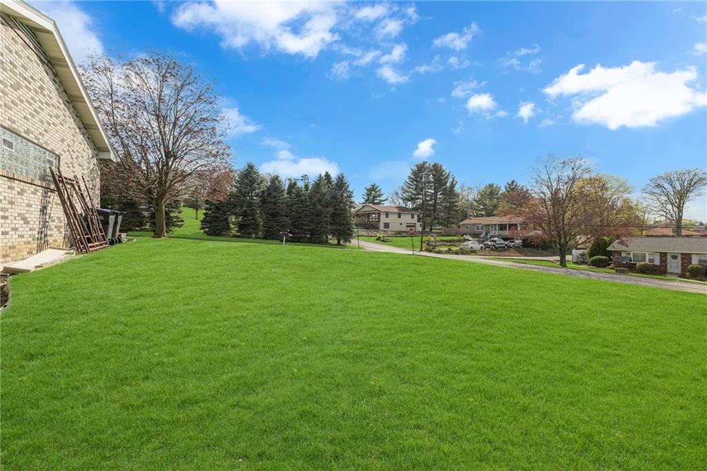 145 Oakhill Road Aliquippa, PA 15001 - Photo 4 of 23 a view of a field of grass and trees