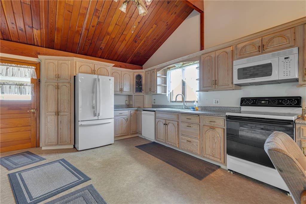 145 Oakhill Road Aliquippa, PA 15001 - Photo 6 of 23 a kitchen with white cabinets and white appliances