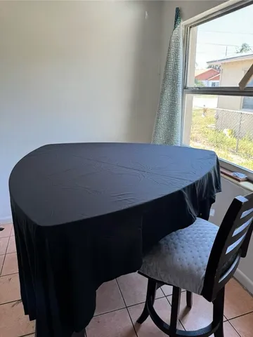 a front view of a furniture room with a window