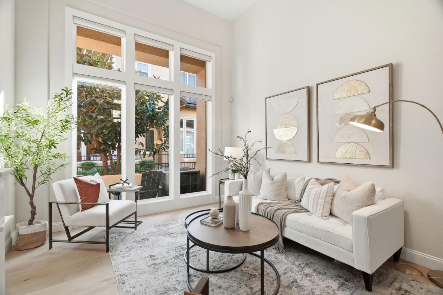 5050 Ruffino Terrace San Jose, CA 95129 - Photo 1 of 26 a living room with furniture and a large window
