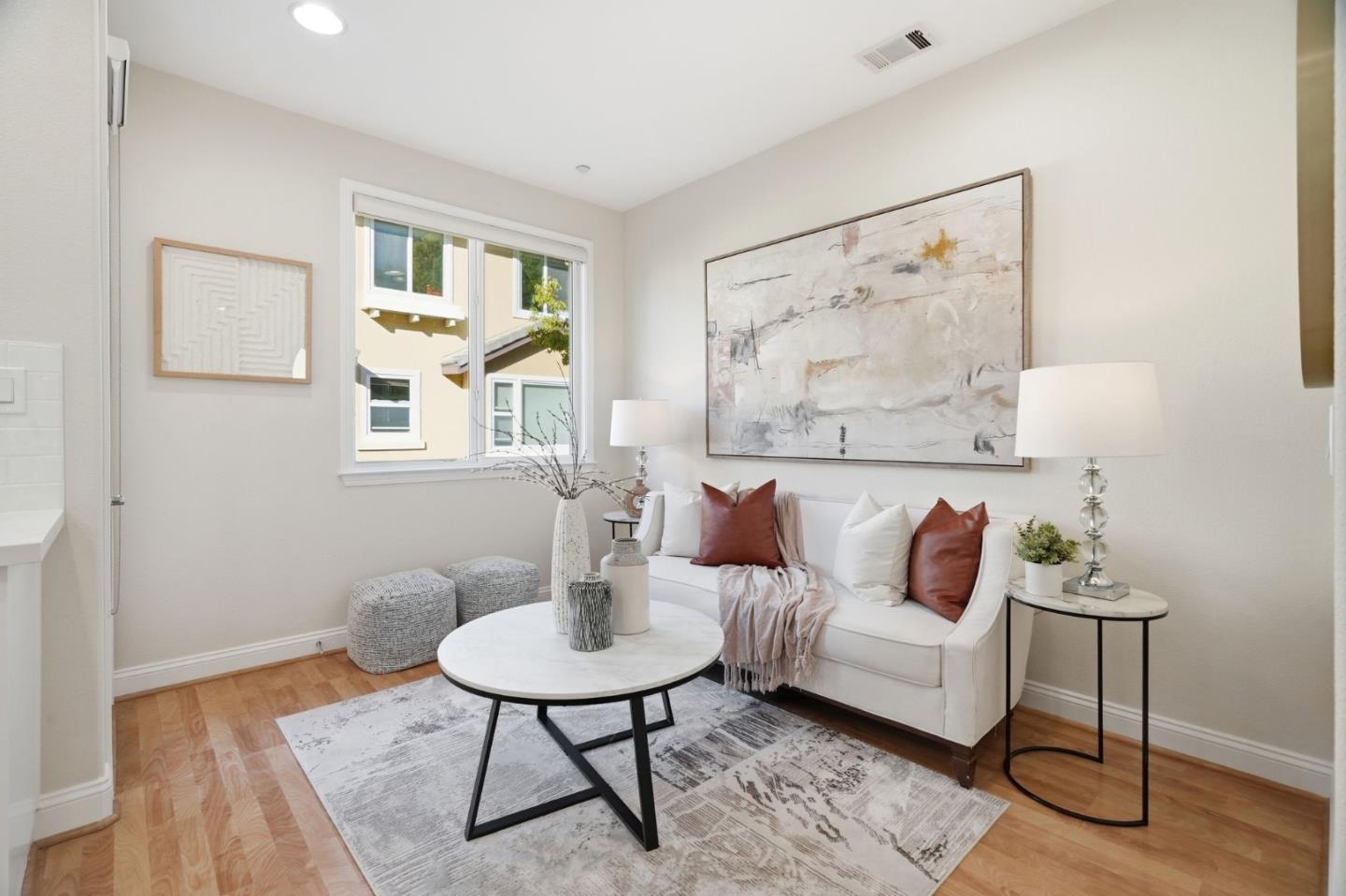 5050 Ruffino Terrace San Jose, CA 95129 - Photo 12 of 26 a living room with furniture and a table