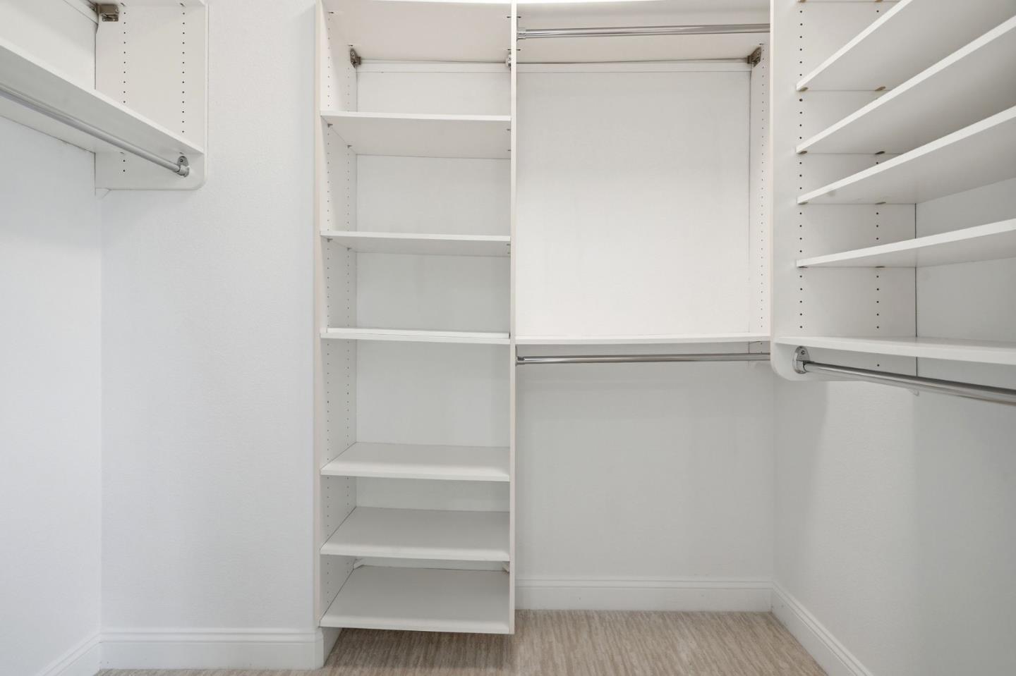 5050 Ruffino Terrace San Jose, CA 95129 - Photo 15 of 26 a view of walk in closet with empty racks