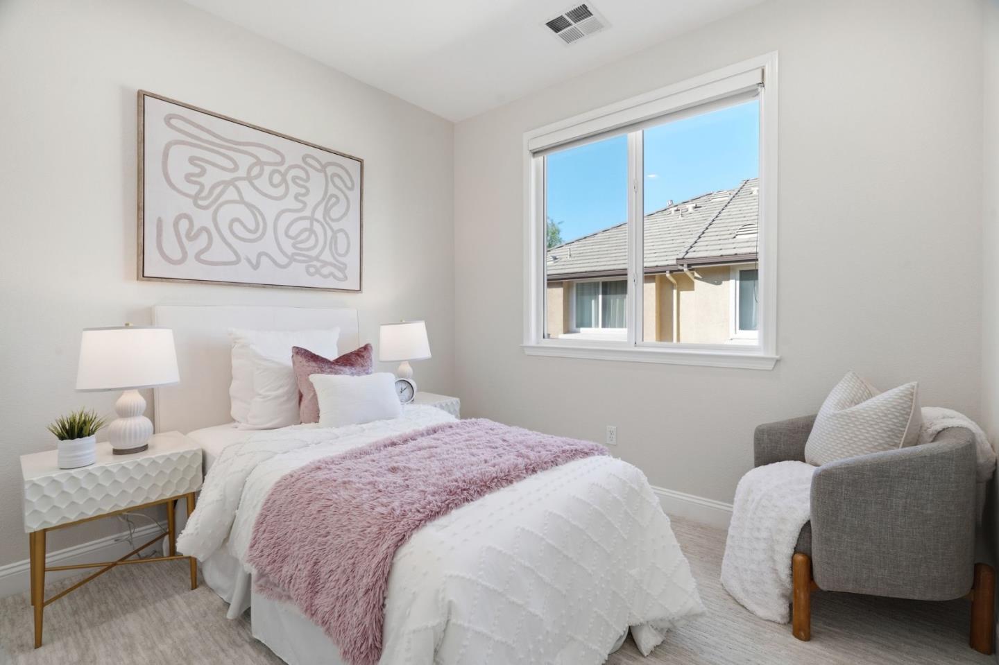 5050 Ruffino Terrace San Jose, CA 95129 - Photo 18 of 26 a bedroom with bed and a window