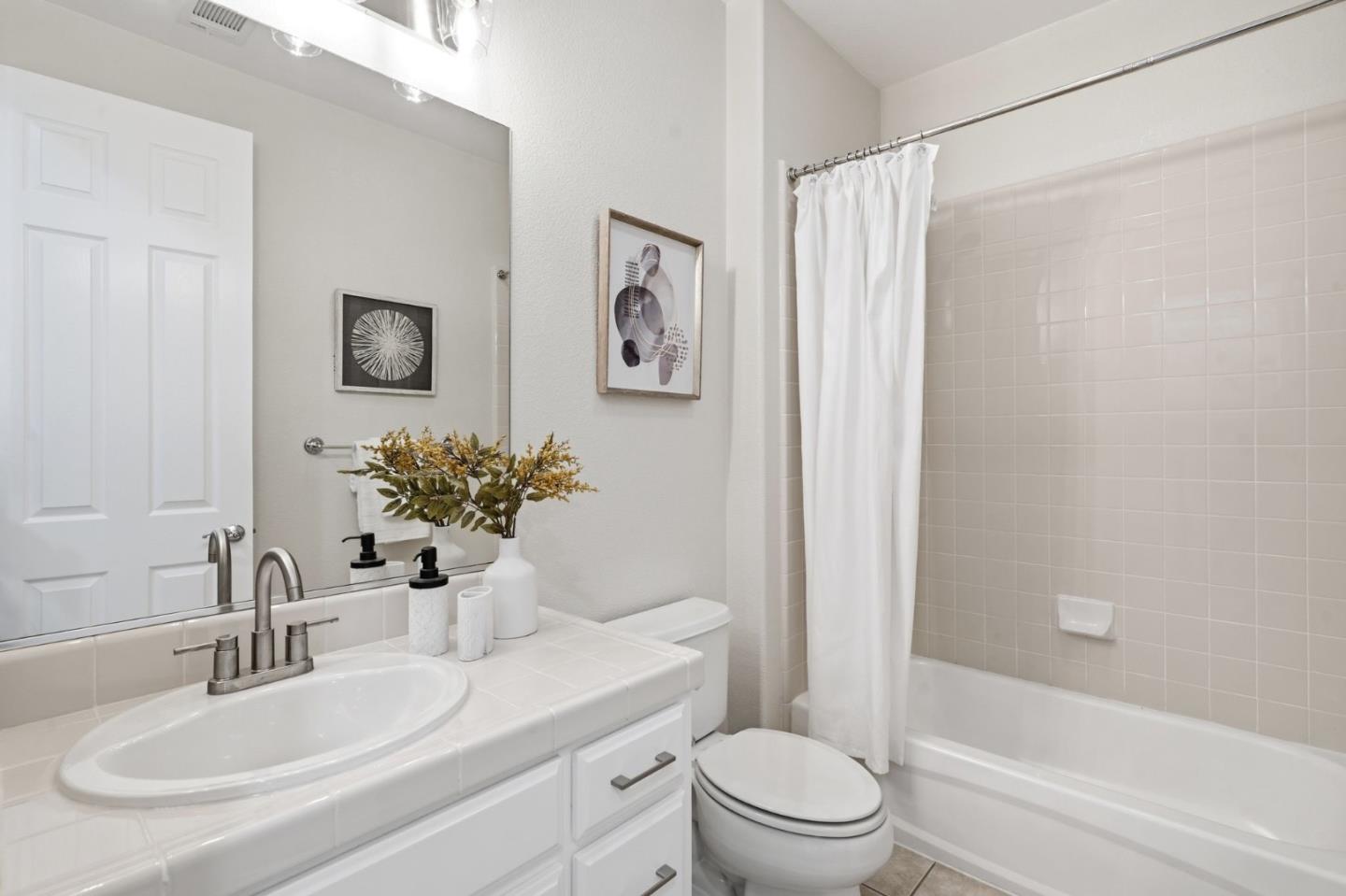 5050 Ruffino Terrace San Jose, CA 95129 - Photo 20 of 26 a bathroom with a sink toilet and shower