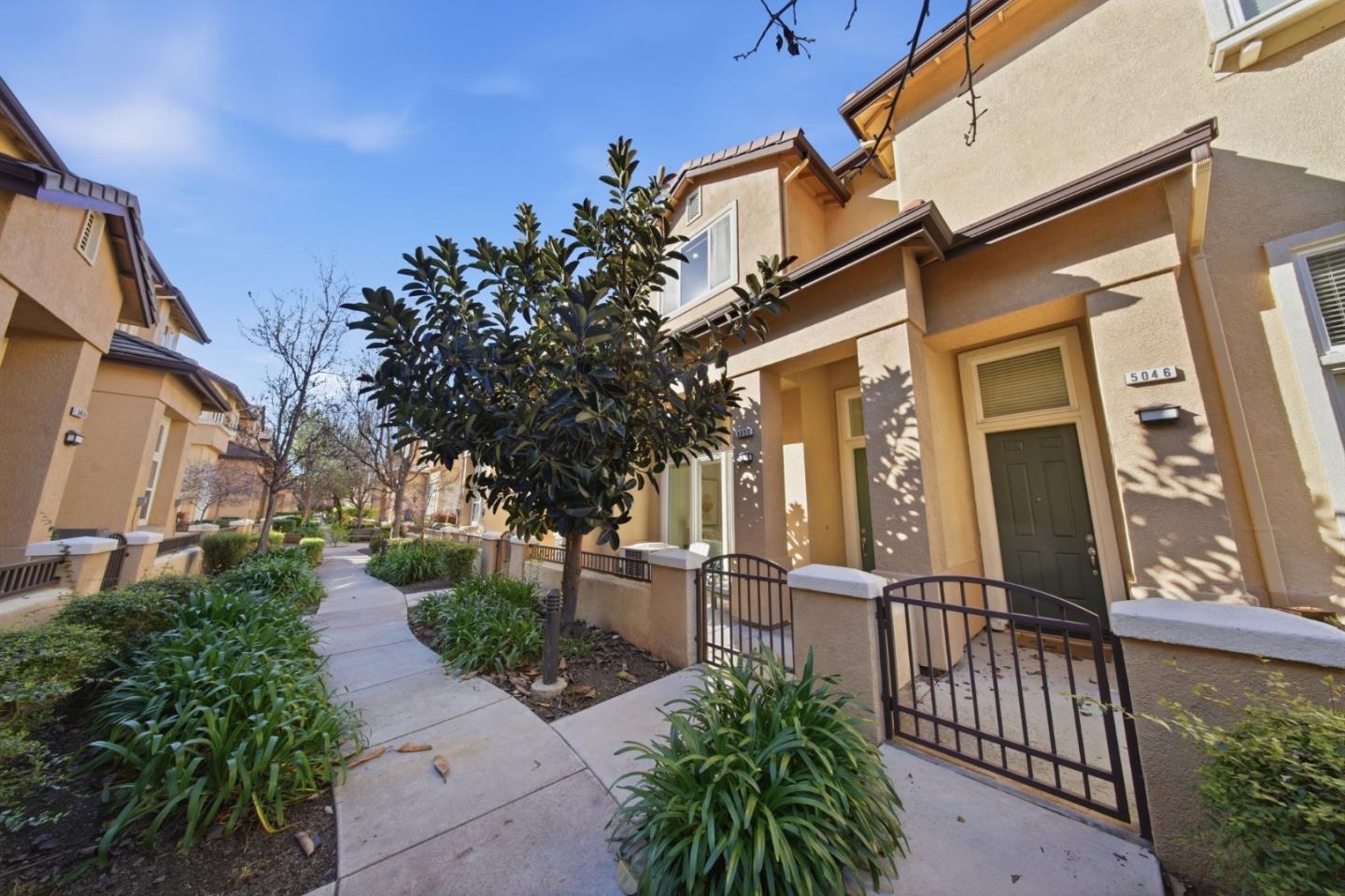 5050 Ruffino Terrace San Jose, CA 95129 - Photo 2 of 26 front view of a house with a small yard