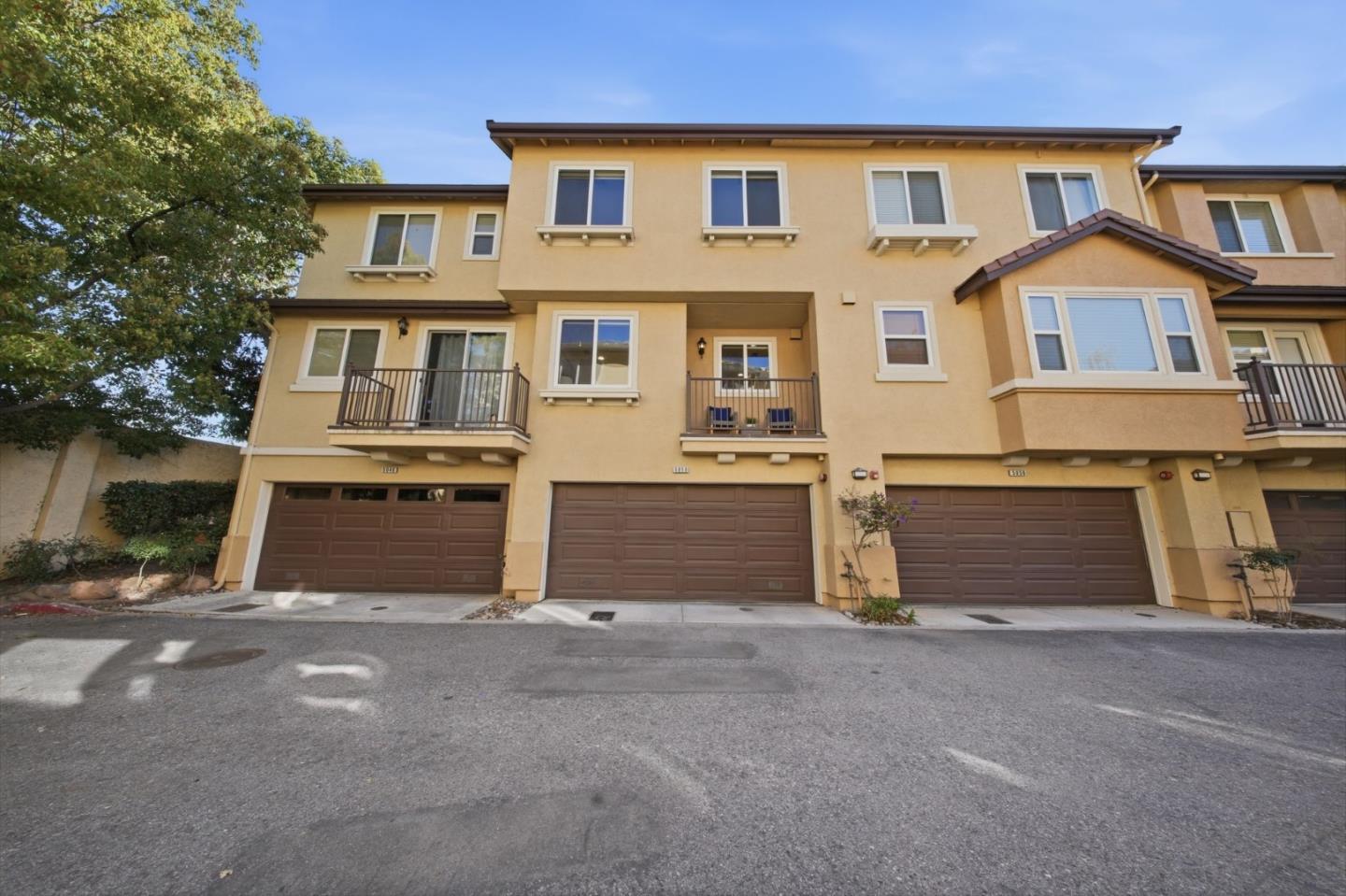 5050 Ruffino Terrace San Jose, CA 95129 - Photo 23 of 26 a front view of a house with a yard and garage