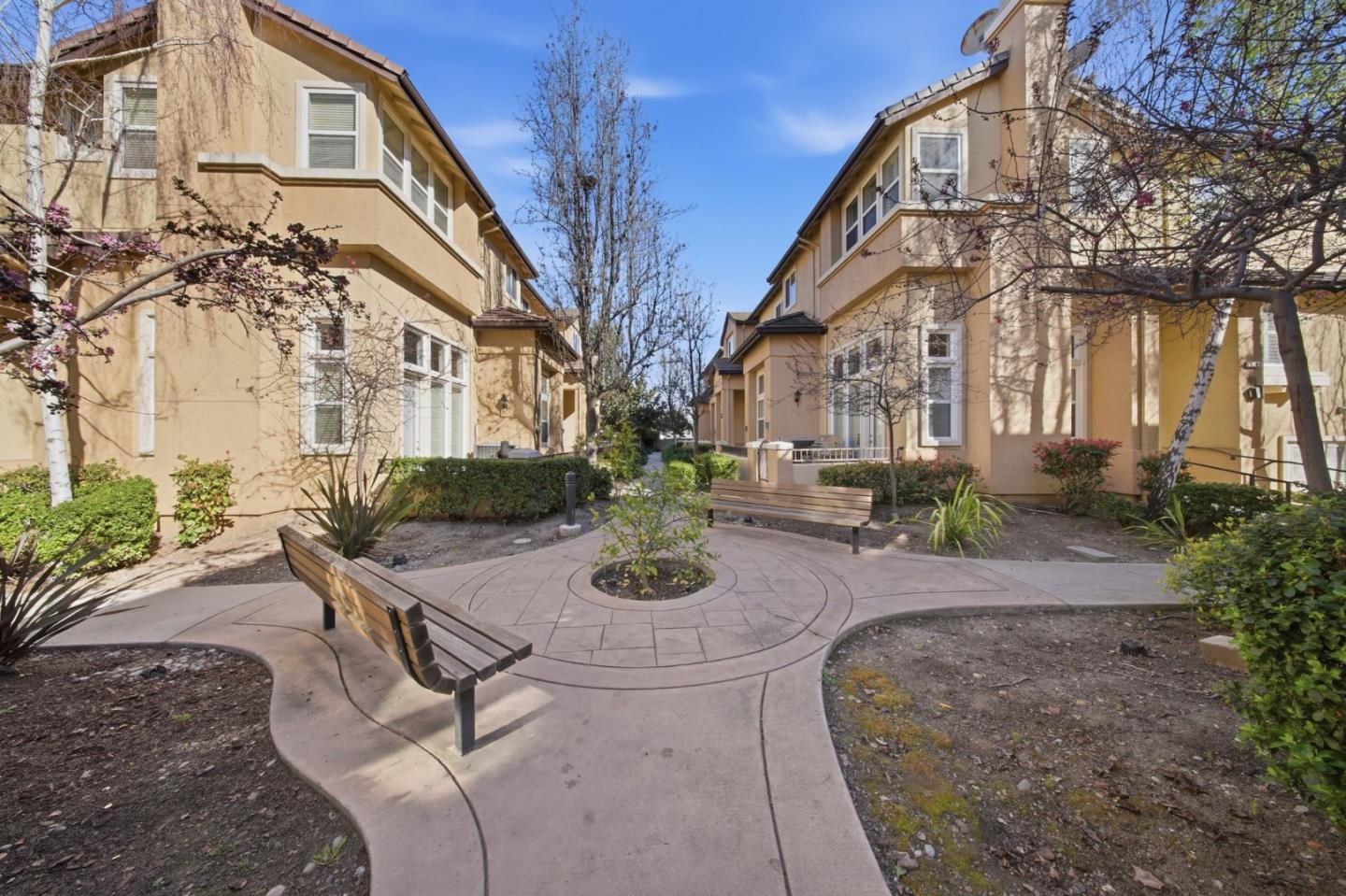 5050 Ruffino Terrace San Jose, CA 95129 - Photo 24 of 26 a view of a house with backyard and sitting area