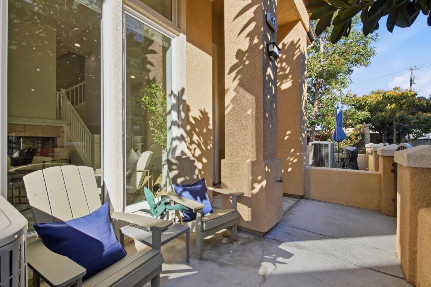 5050 Ruffino Terrace San Jose, CA 95129 - Photo 6 of 26 a living room with furniture and a potted plant