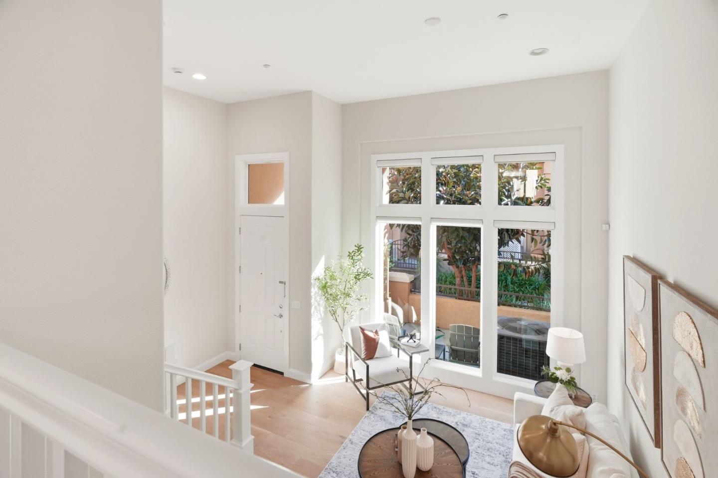5050 Ruffino Terrace San Jose, CA 95129 - Photo 8 of 26 a living room with furniture and large window