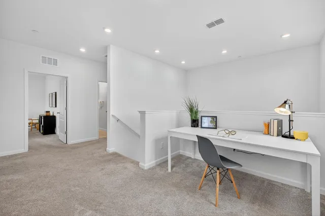 a workspace with furniture and window