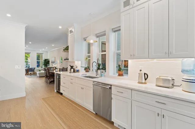 a kitchen with sink and cabinets