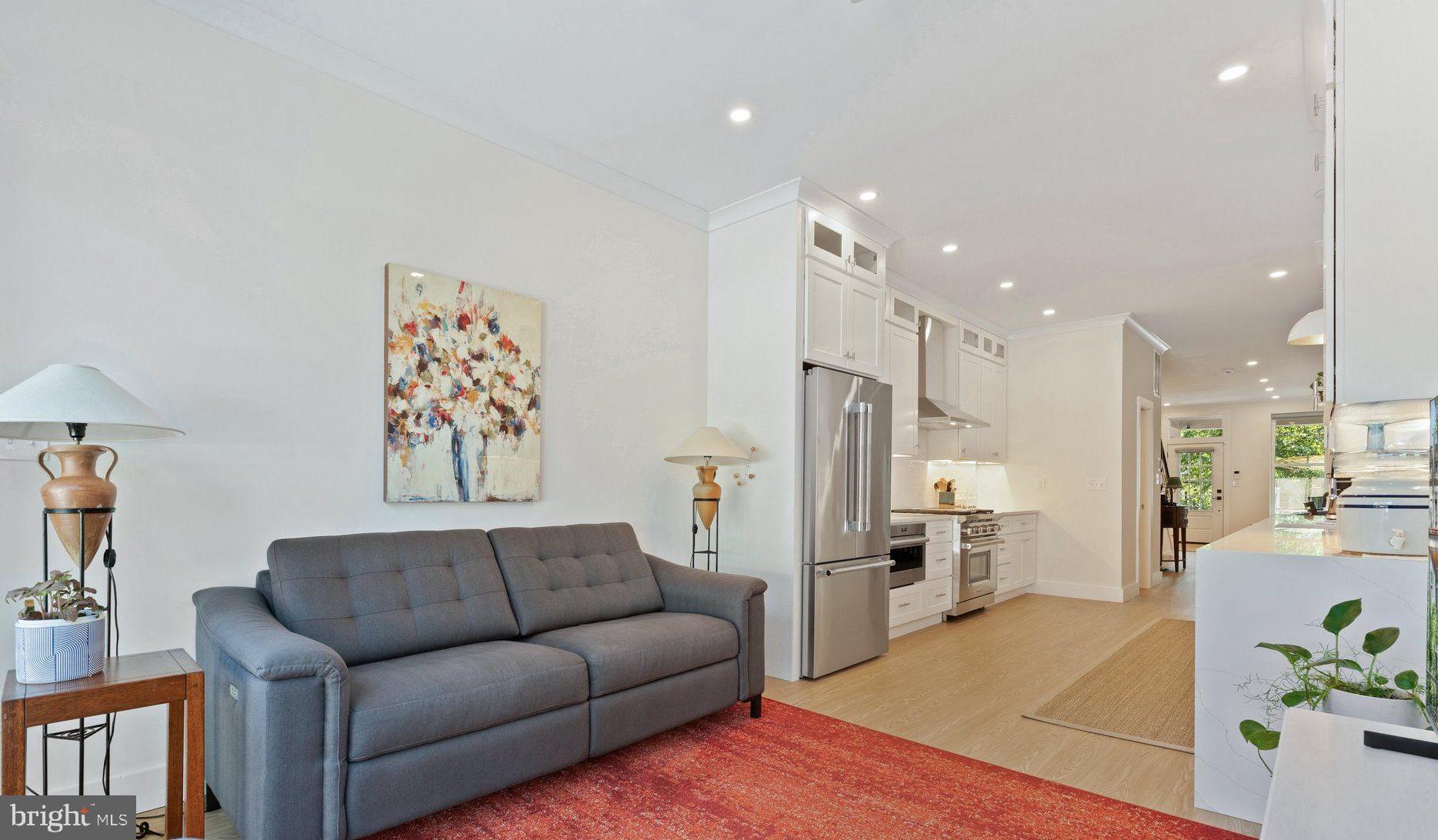 922 8th Street Northeast Washington, DC 20002 - Photo 12 of 44 a living room with furniture and kitchen view