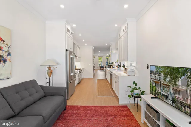a living room with furniture and a rug