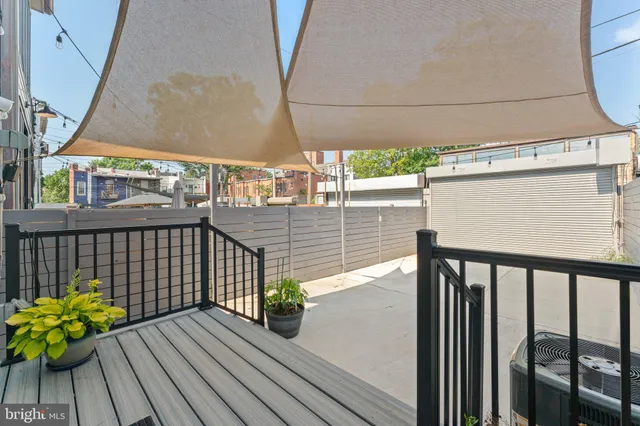 a view of balcony with wooden floor