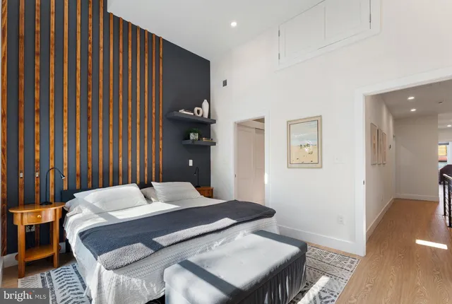 a bedroom with a bed and a table in it