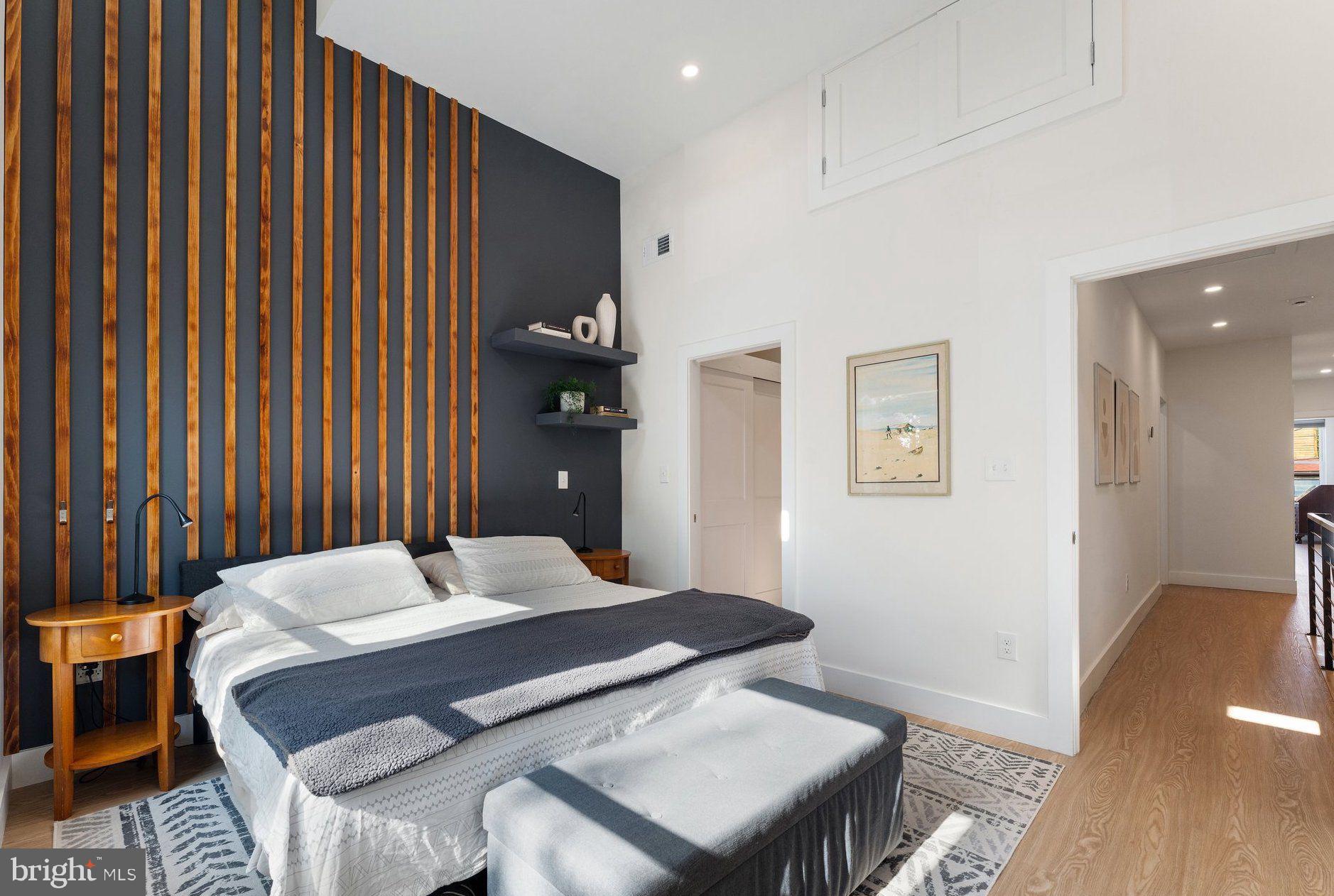 922 8th Street Northeast Washington, DC 20002 - Photo 17 of 44 a bedroom with a bed and a table in it