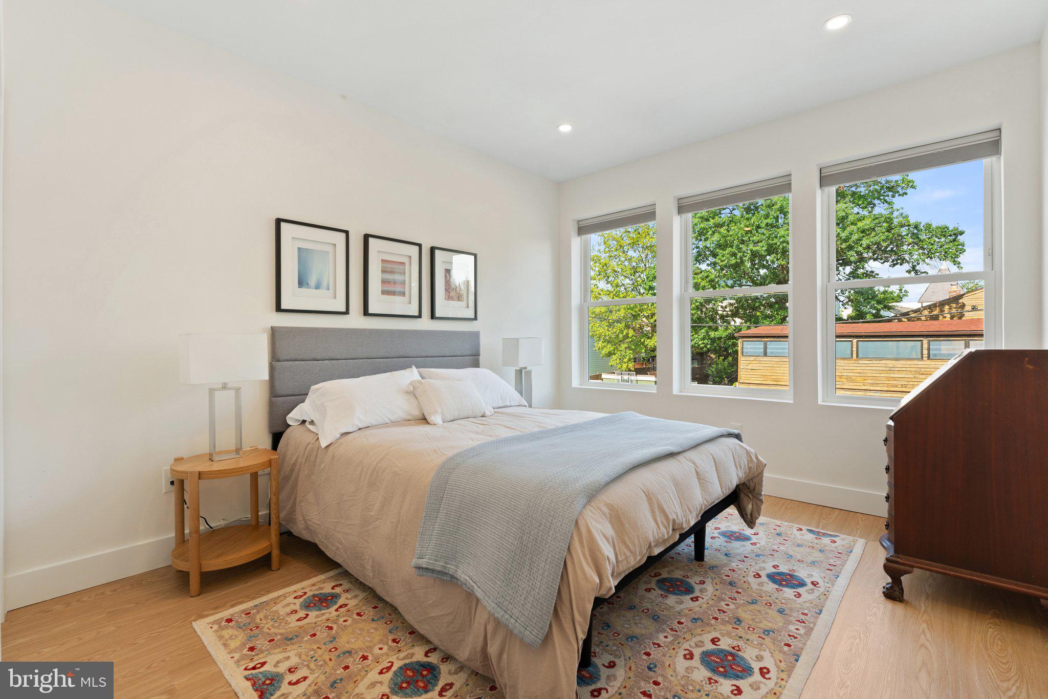 922 8th Street Northeast Washington, DC 20002 - Photo 22 of 44 a bedroom with a bed and wooden floor
