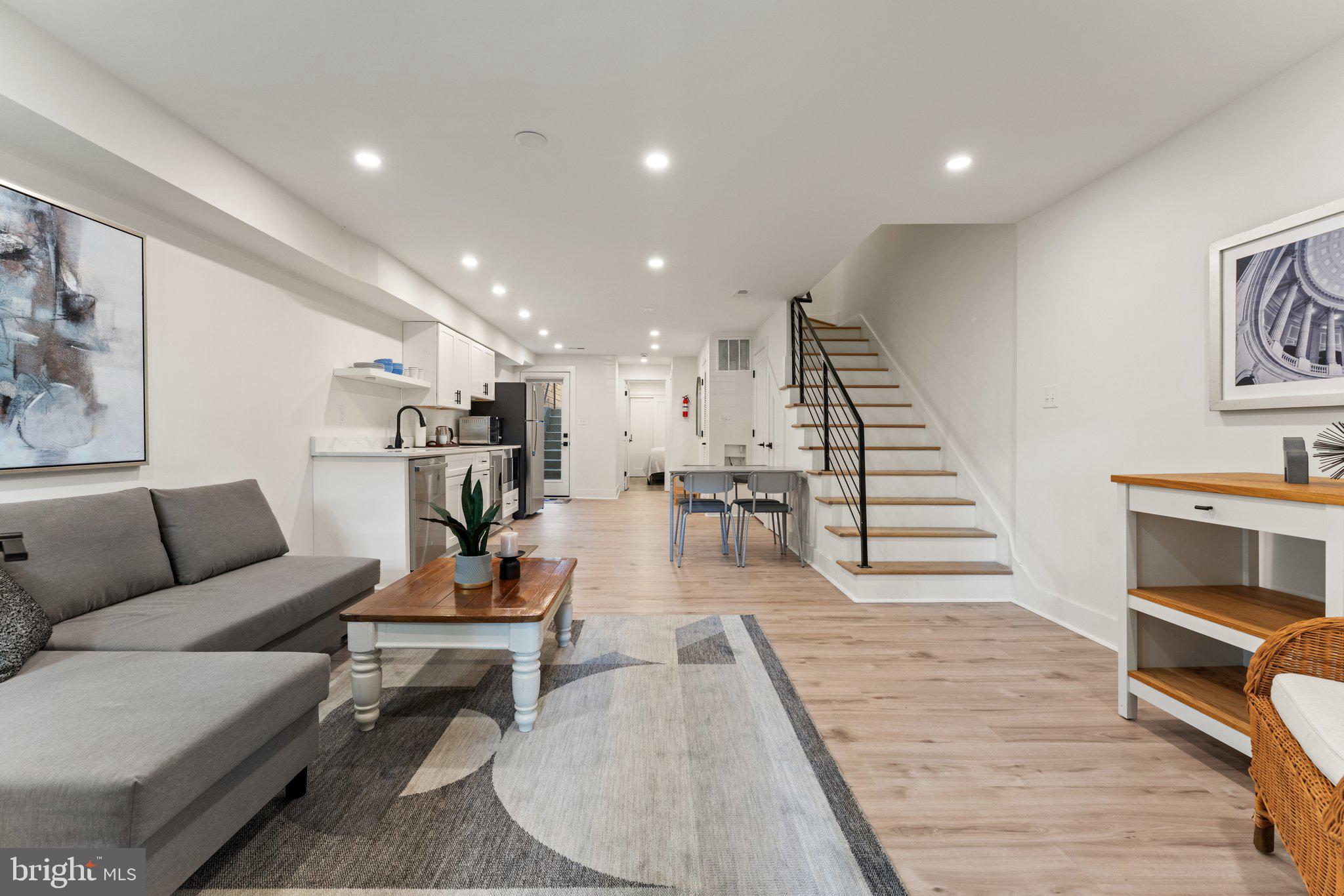 922 8th Street Northeast Washington, DC 20002 - Photo 29 of 44 a living room with furniture and wooden floor