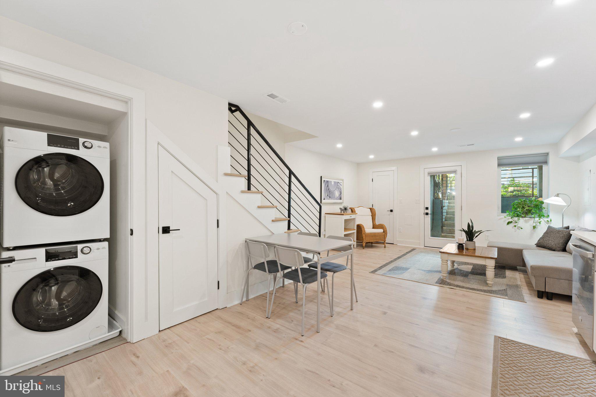 922 8th Street Northeast Washington, DC 20002 - Photo 33 of 44 a living room with furniture and a wooden floor