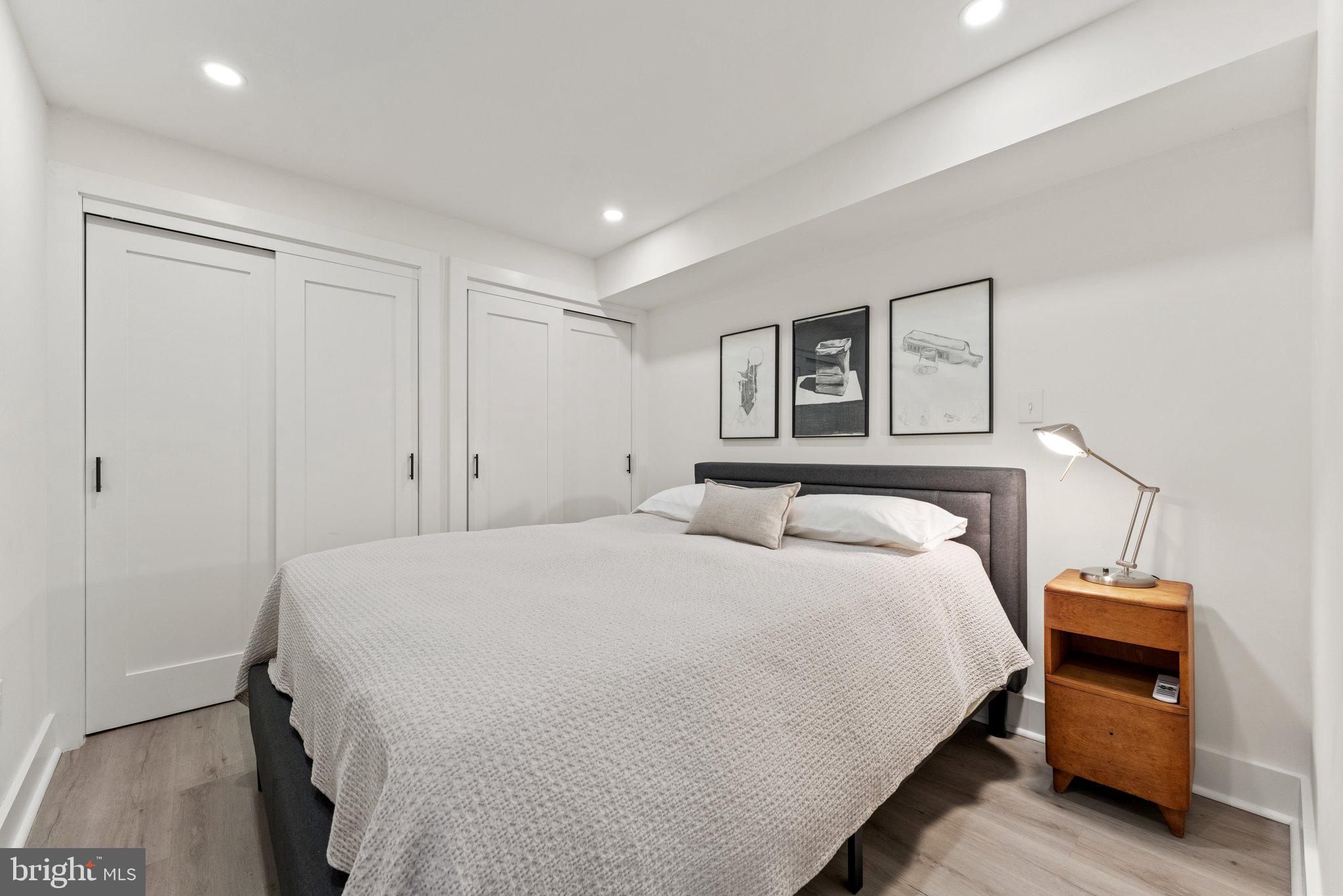 922 8th Street Northeast Washington, DC 20002 - Photo 36 of 44 a bedroom with a bed and a night stand