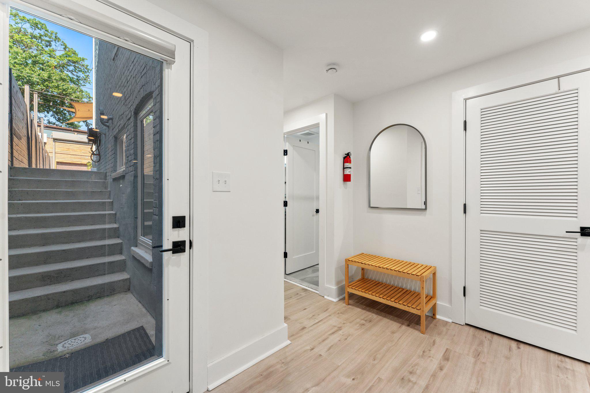 922 8th Street Northeast Washington, DC 20002 - Photo 39 of 44 a view of a hallway with entryway wooden floor and front door